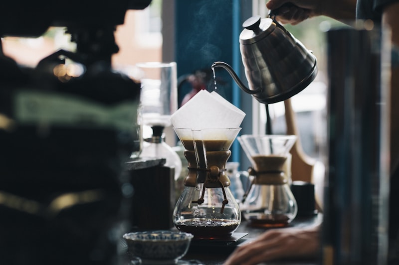 Barista carefully pouring a latte