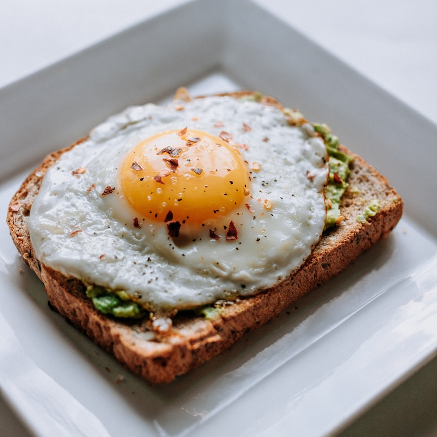 Avocado toast with eggs on a wooden board