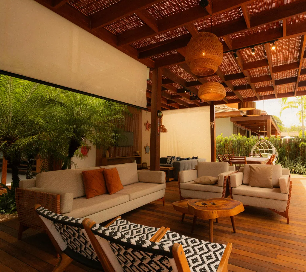Covered patio with wood pergola, lounge seating, and pendant lighting