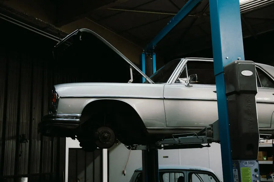 Vehicle lifted on a hydraulic two-post lift