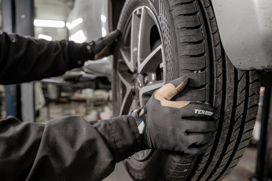 Mechanic mounting a fresh tire in the shop