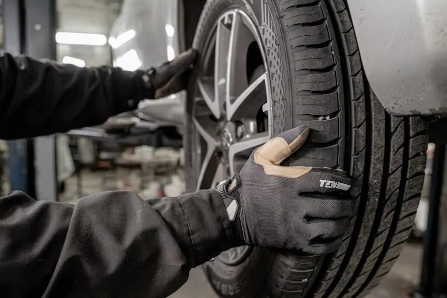 Mechanic mounting a fresh tire in the shop