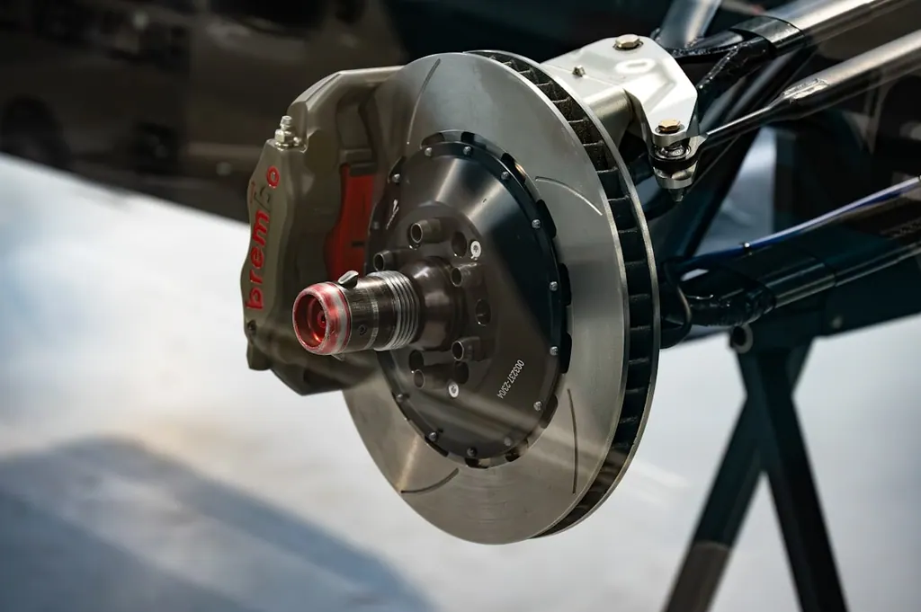 Brake rotor and caliper exposed during a brake service
