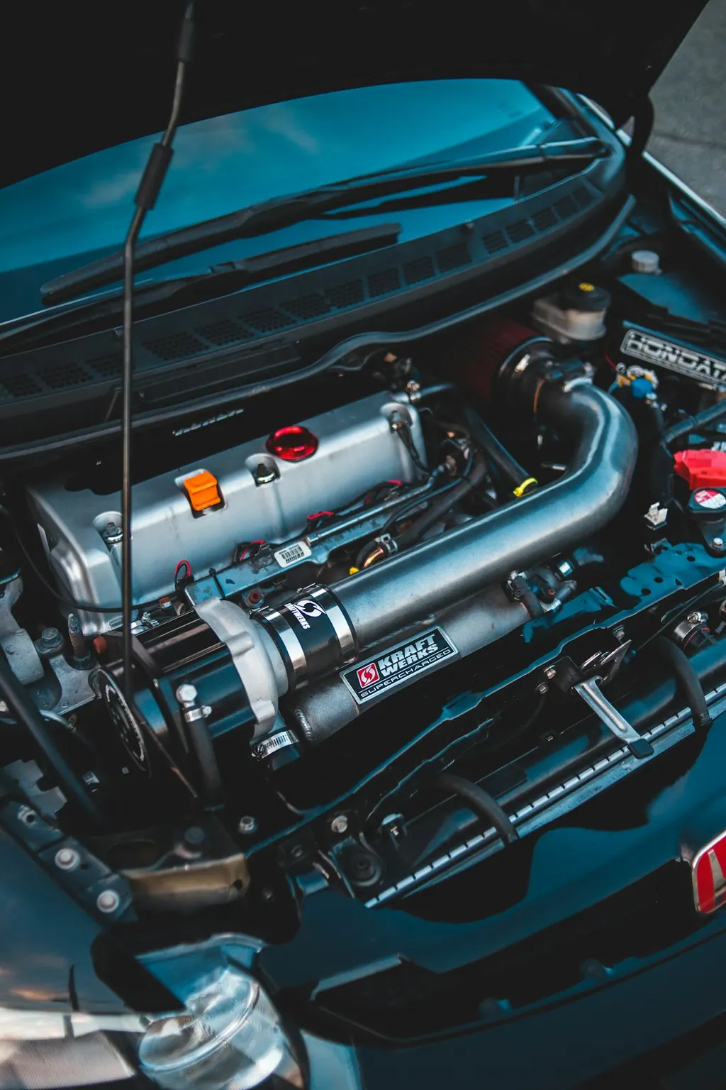 Tuned engine bay with intercooler piping and custom intake